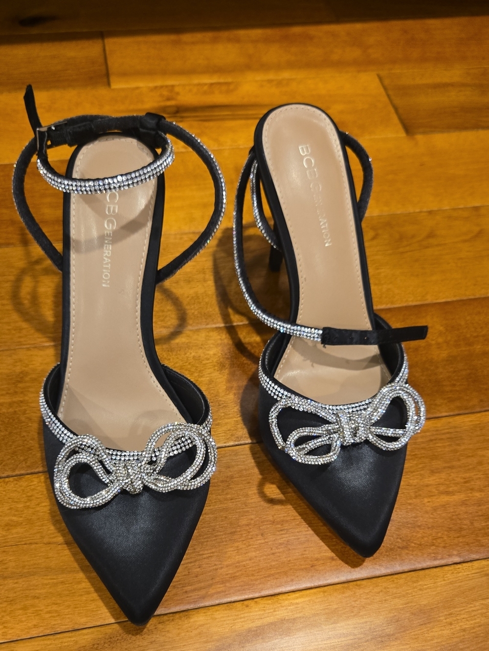 BCBGeneration Black Satin Pointed Toe Heels with Rhinestone Bow
